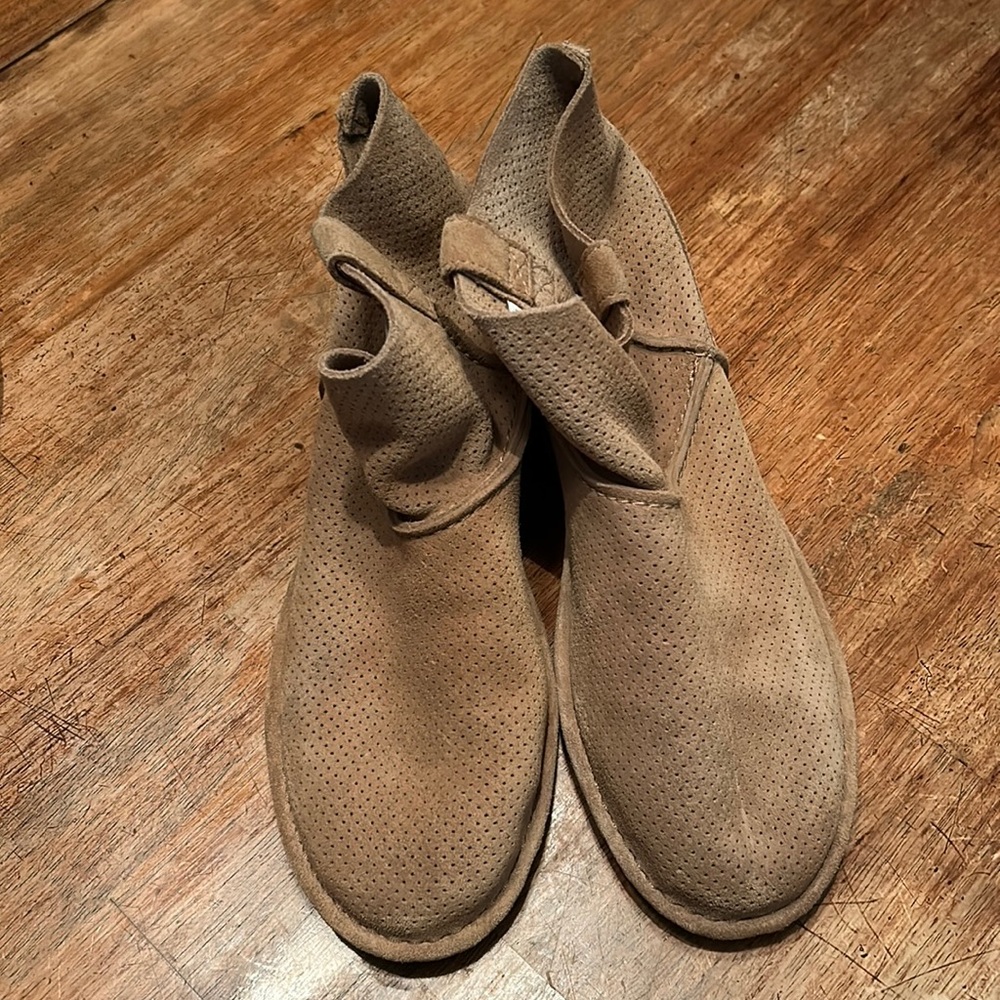 Ugg ankle bootie. Never worn. Perforated leather. Tan